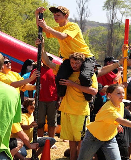 Group of participants involved in a team challenge outdoors