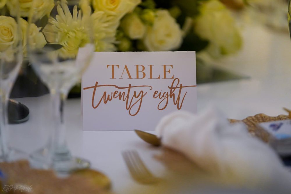 Table number twenty-eight sign on a dining table
