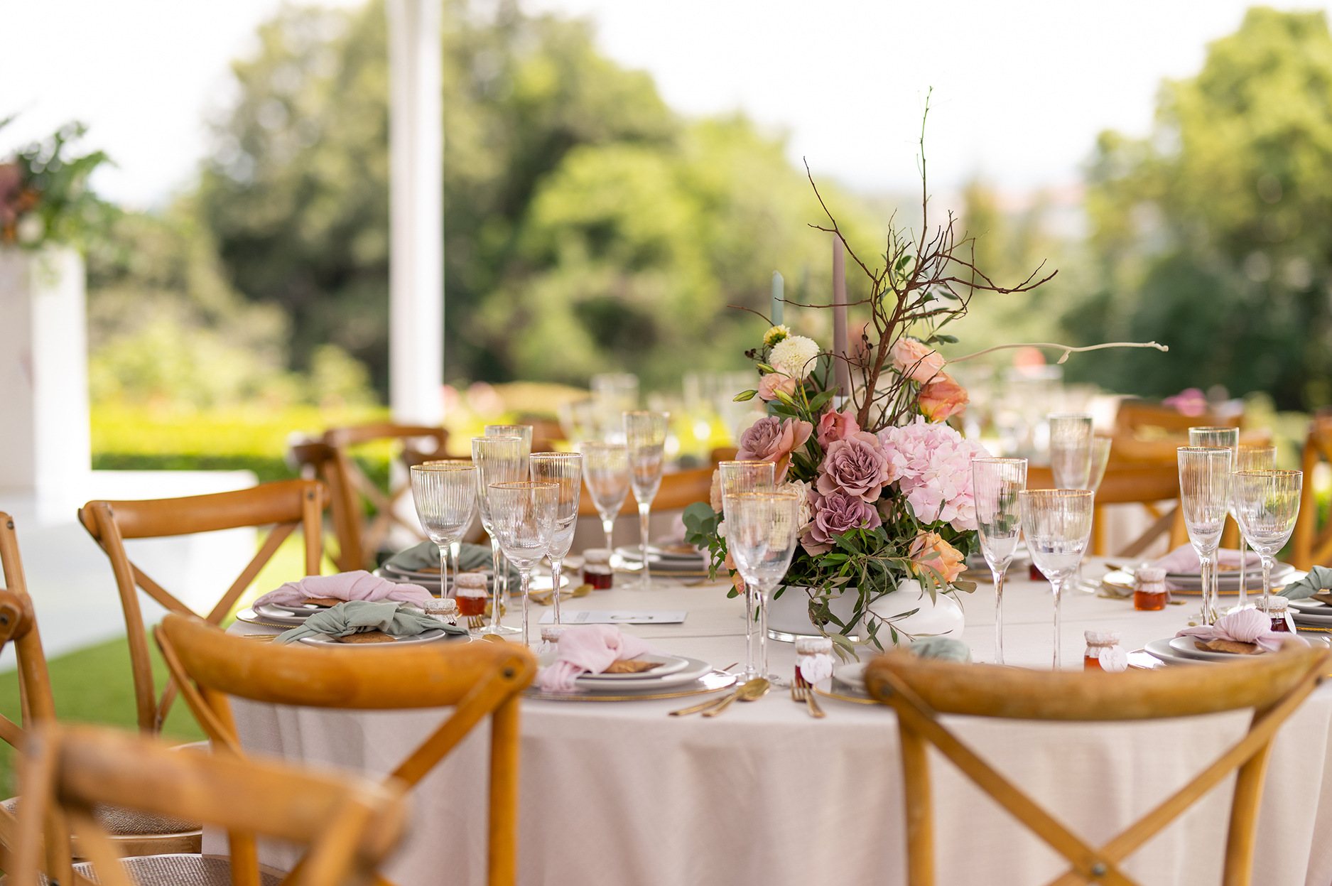 Elegant table setup with flowers and fine tableware.