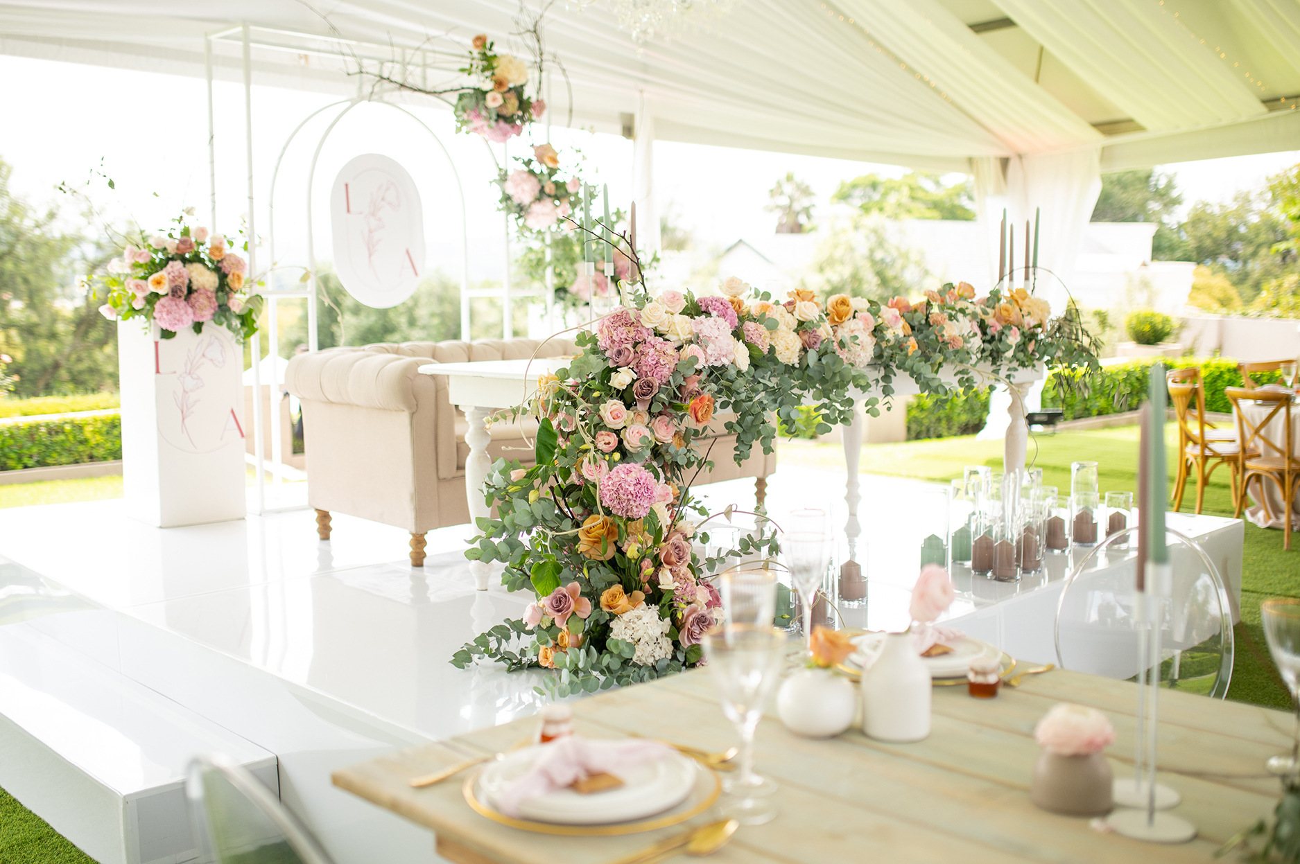 Floral decorations and elegant seating for a proposal setup