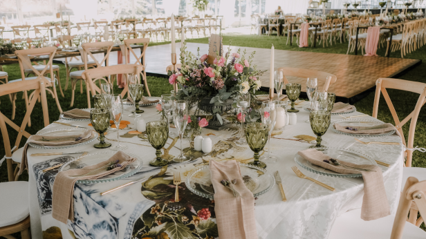 Table set with floral centerpiece, glassware, and elegant tableware