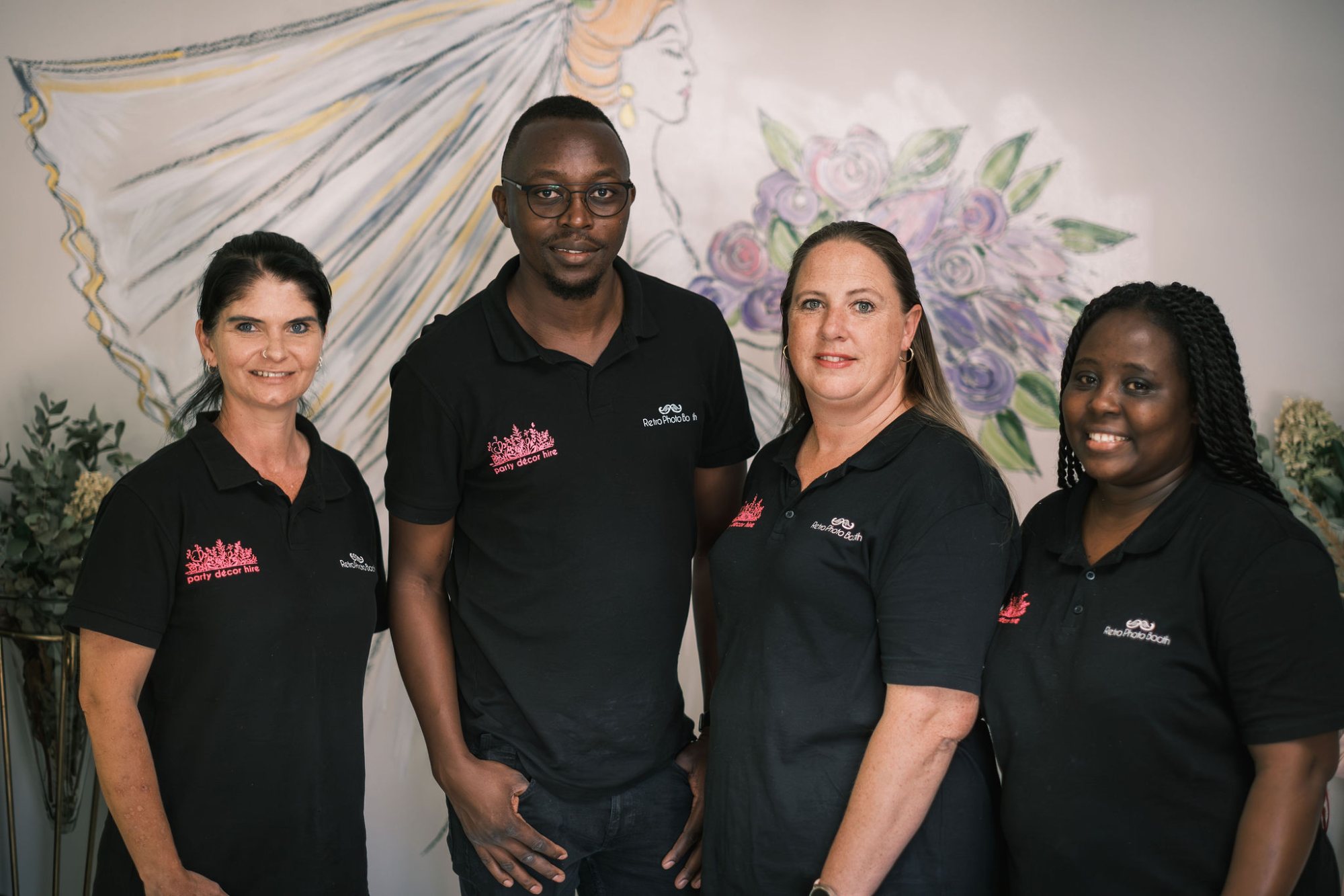 Group portrait of the event planning team in black shirts