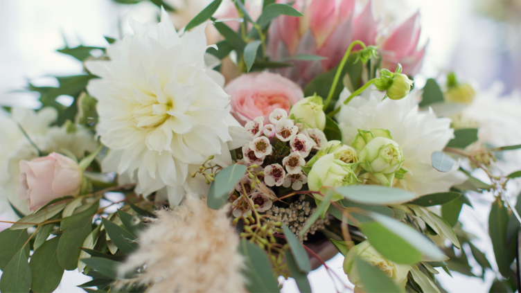 Colorful floral arrangement featuring various blooms and greenery
