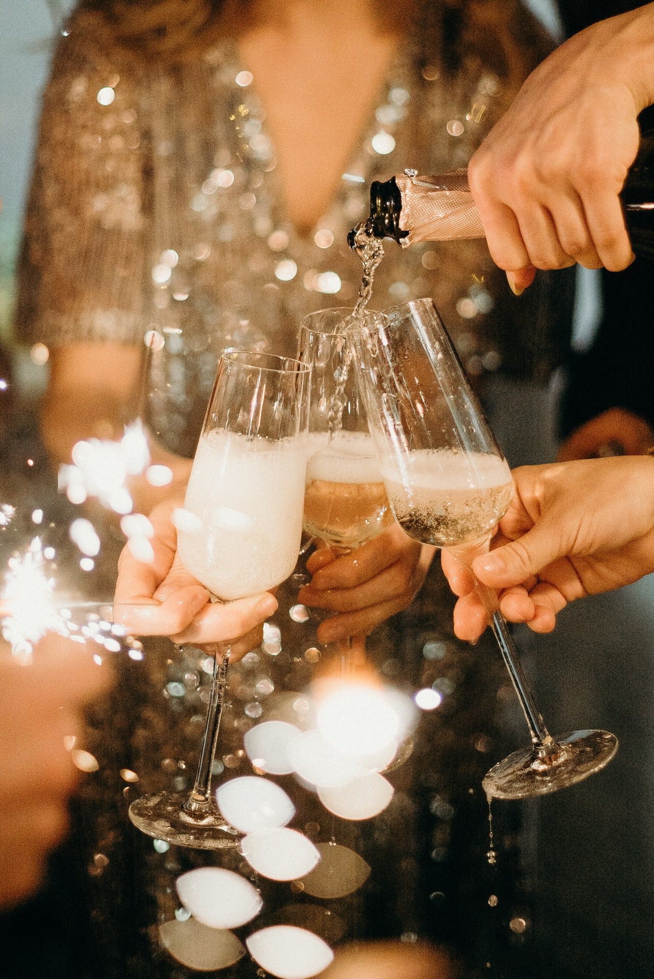 Champagne flutes being toasted together