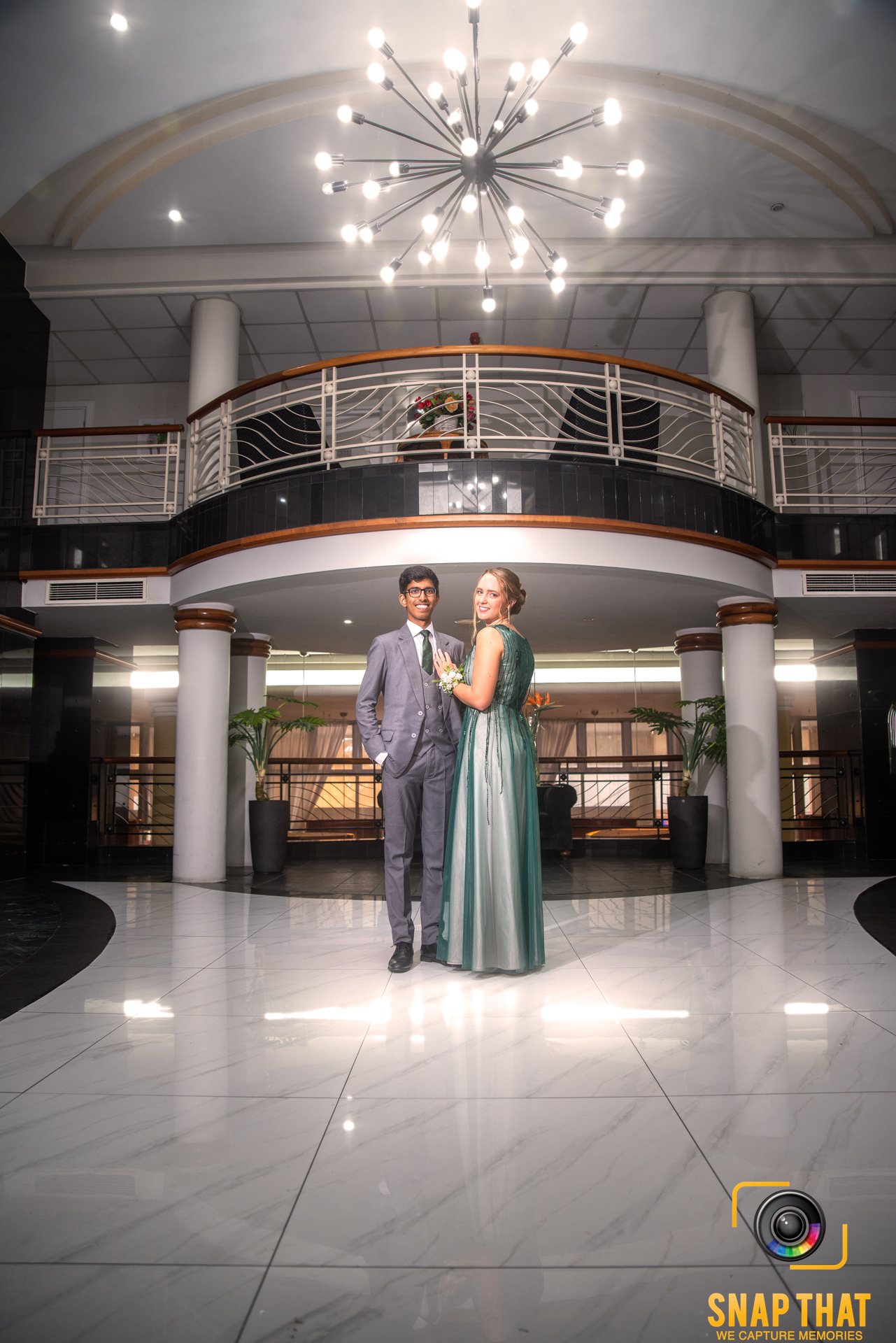 Elegant venue with marble flooring and stylish lighting setup.