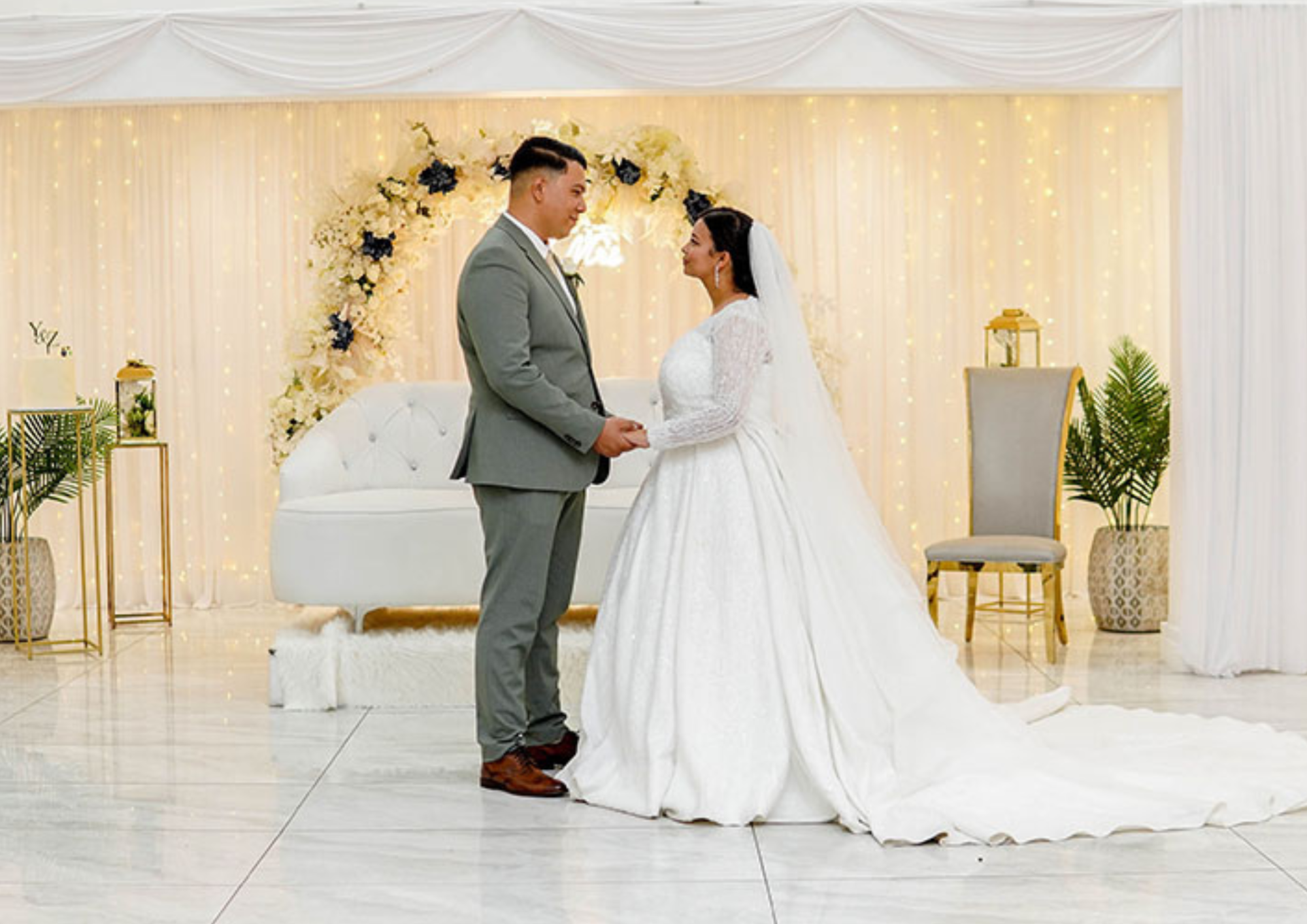 Wedding ceremony setup with floral decor and lighting