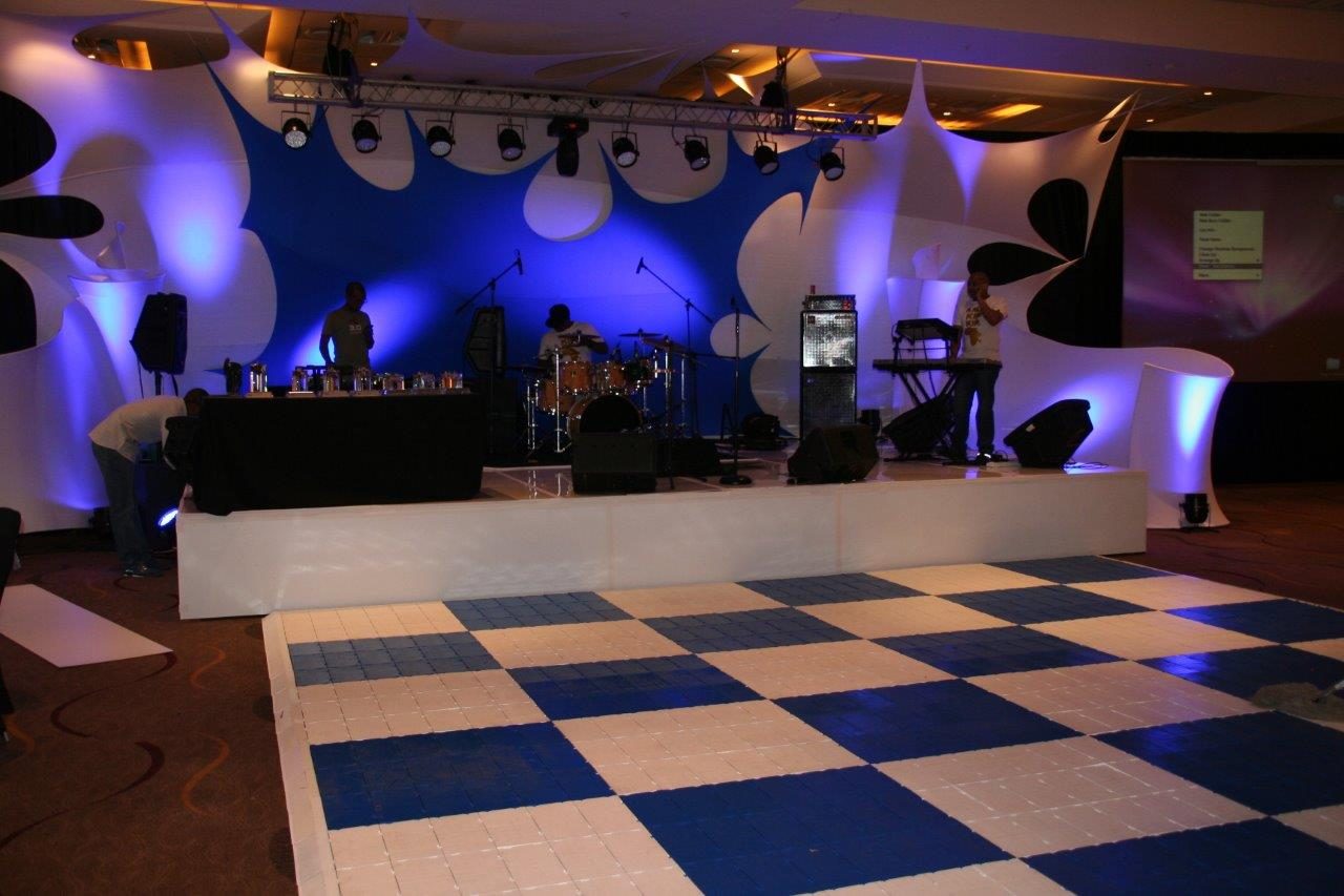Modular dance floor setup with blue and white tiles