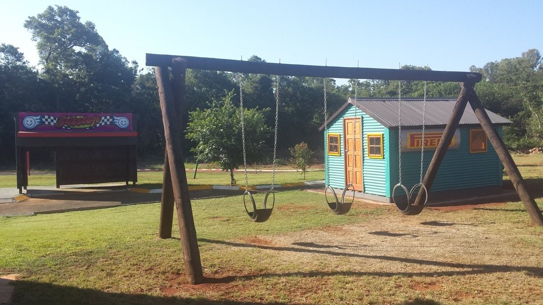Swing set and playhouse in children's play area