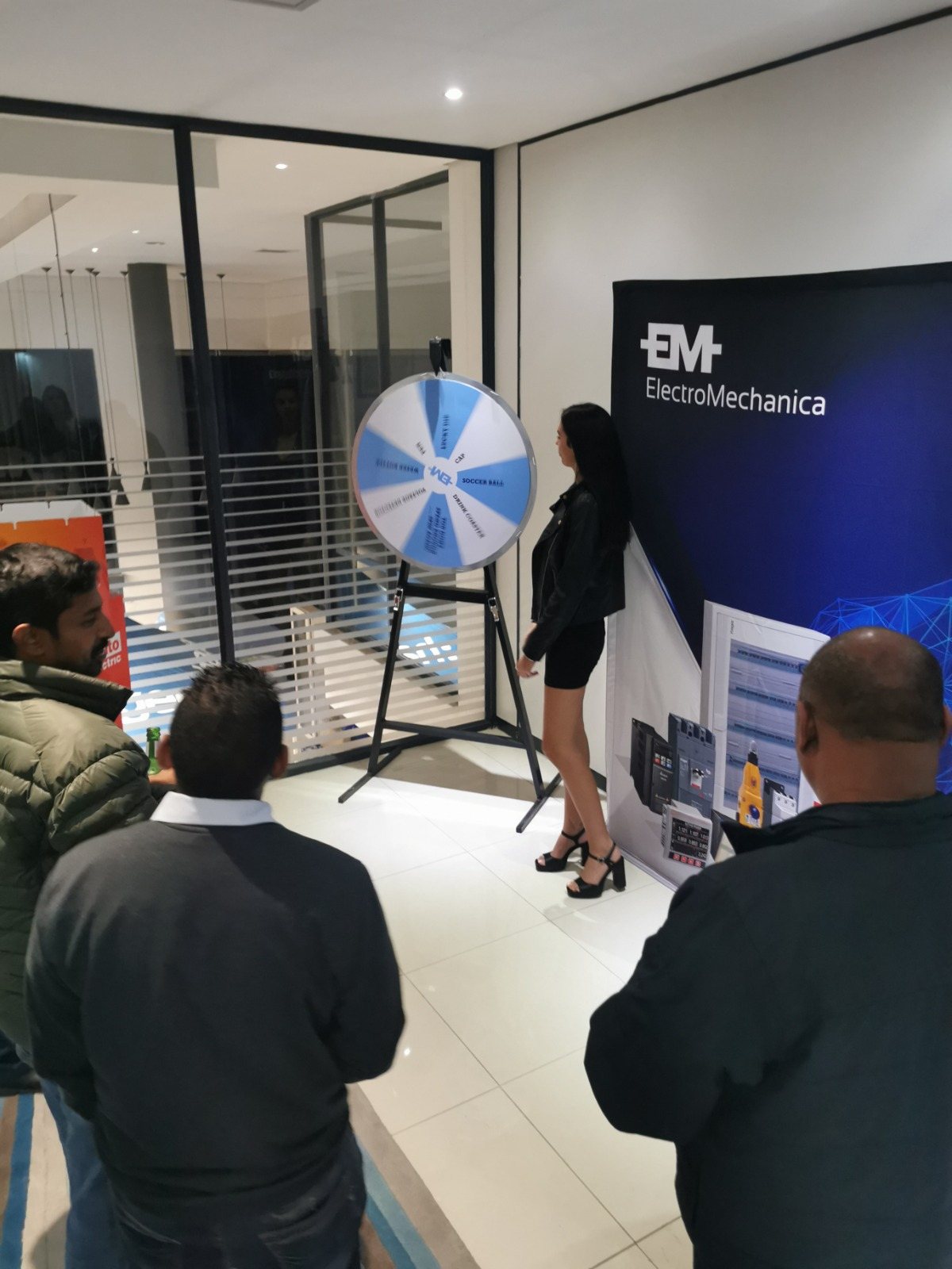 Spin The Wheel station with guests interacting