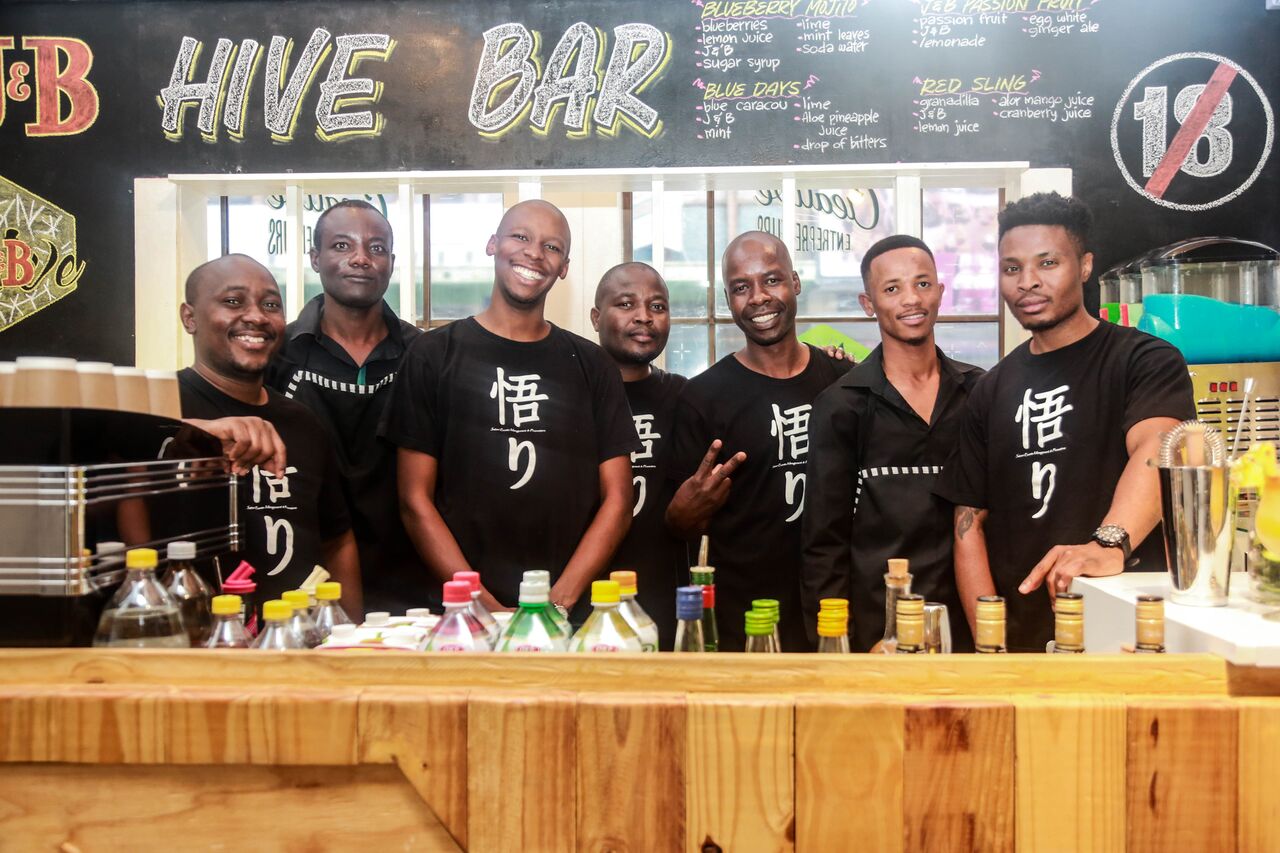 Hive Bar team preparing drinks behind the bar