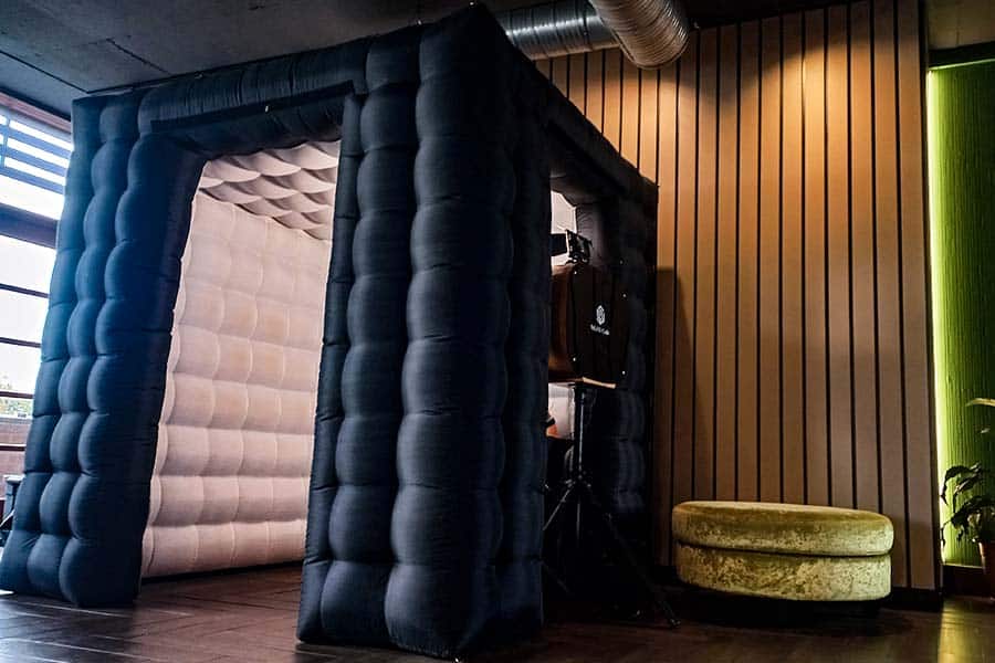 Inflatable photo booth with black exterior and white interior
