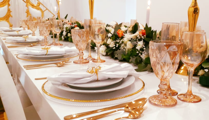Elegant table setting with floral arrangements and fine dining ware