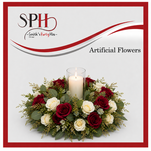 Artificial flower centerpiece with roses and a candle
