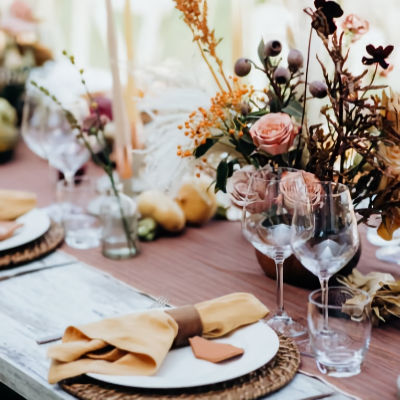 Elegant table setting with floral arrangements and glassware