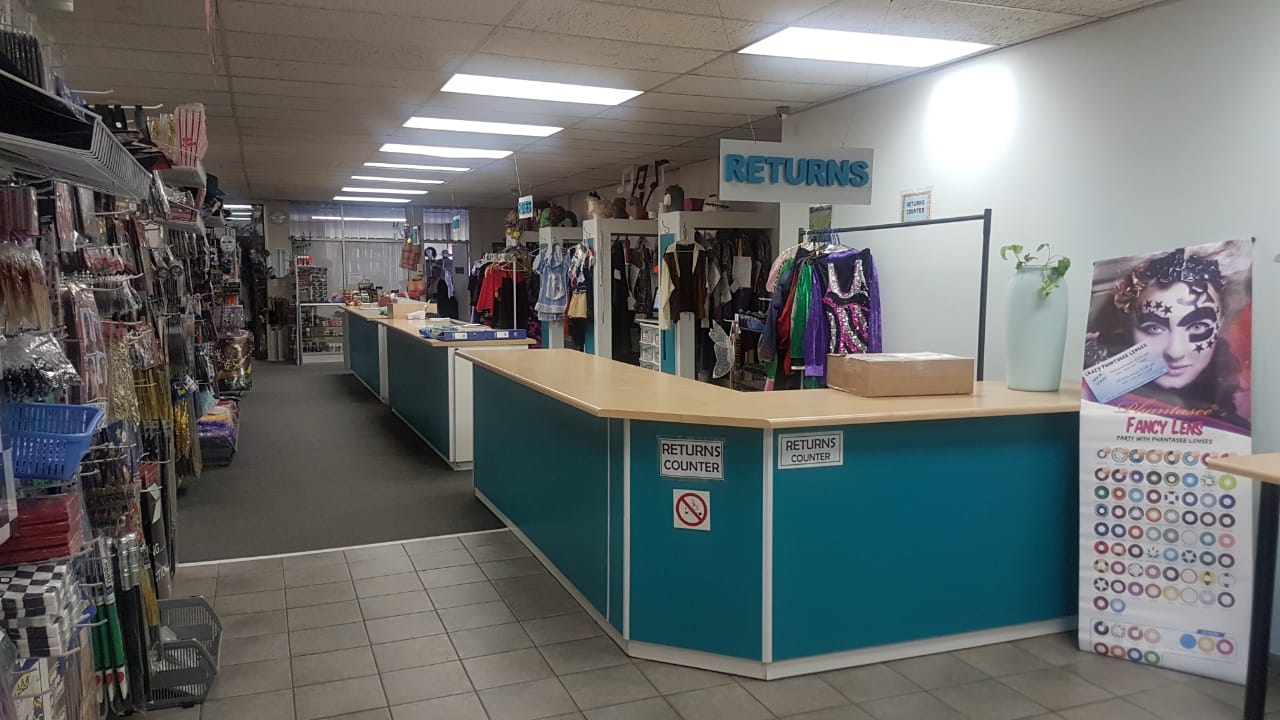 Interior view of the costume hire boutique showing rental counters and costumes