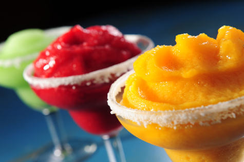 Three colorful slush drinks in glasses