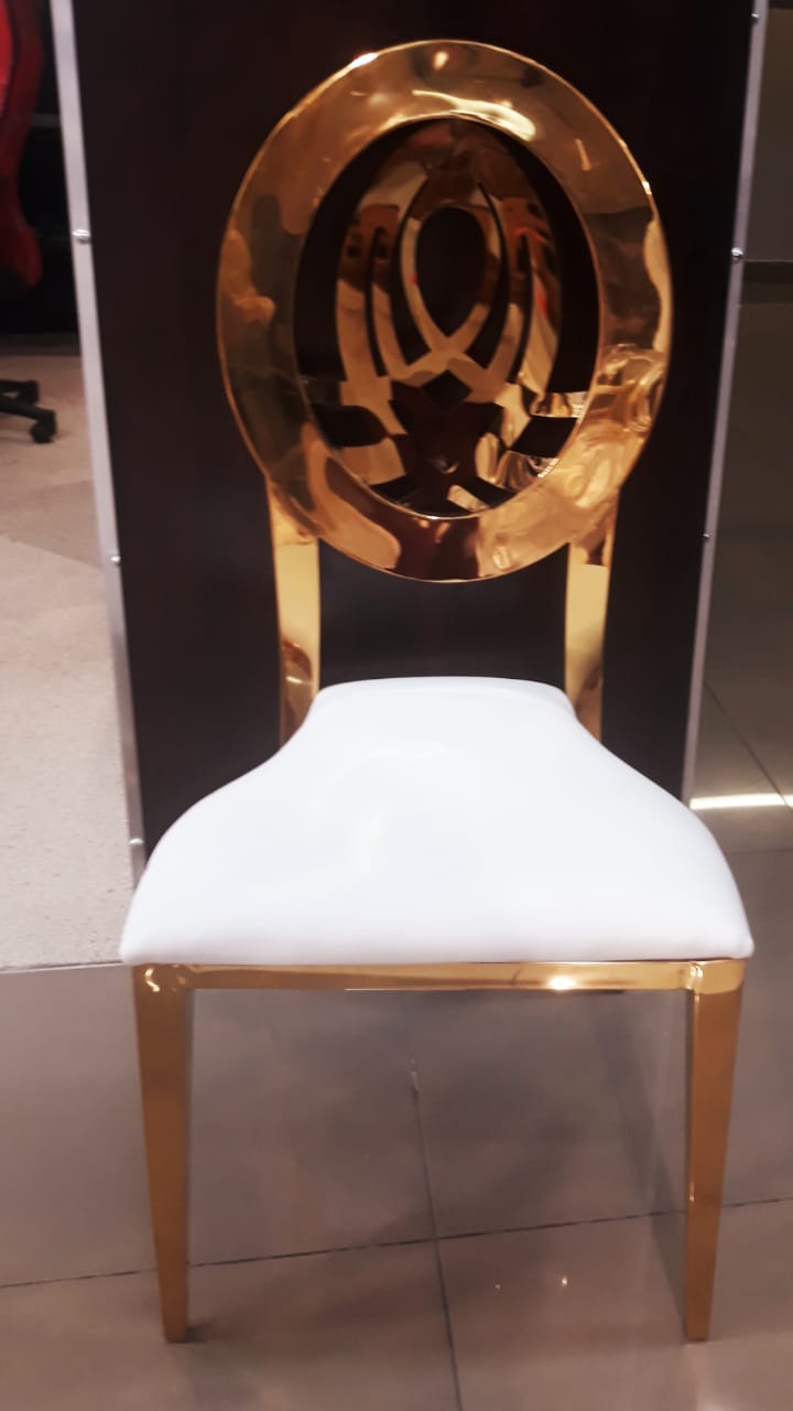 Gold accent chair with a white seat design