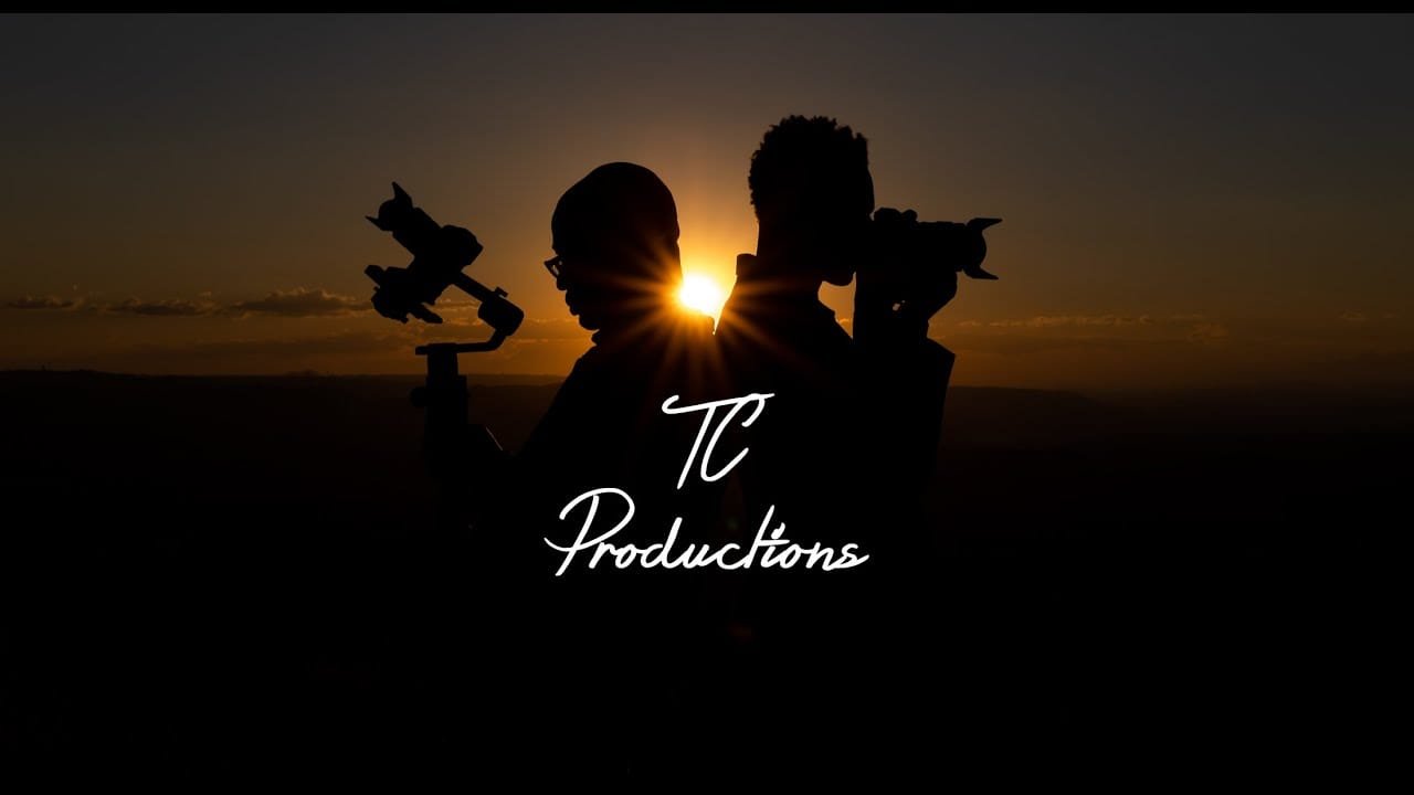 Silhouette of Tc Productions team at sunset