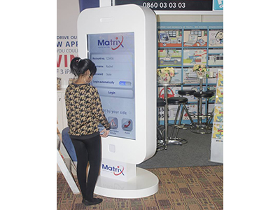 Large interactive digital kiosk in an exhibition setting.