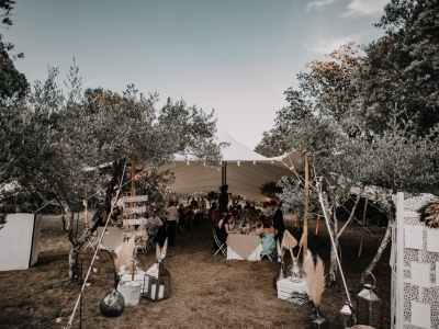 Outdoor event setup under a Bedouin tent.