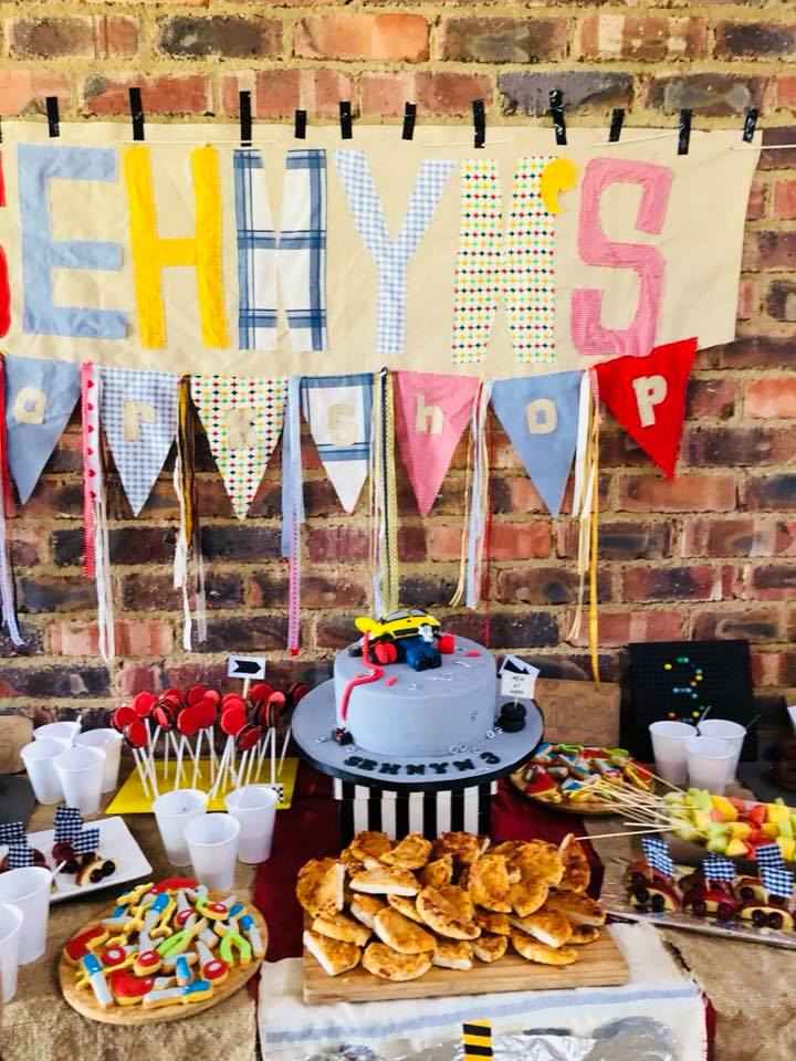 Colorful birthday table with cake and sweets