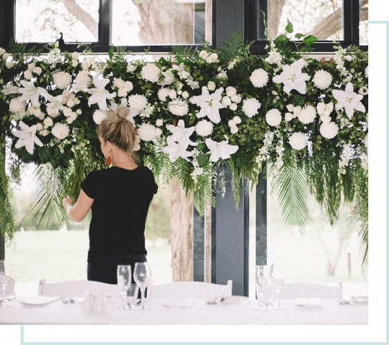 Floral arrangement hanging above a dining table