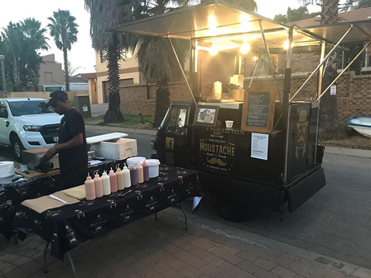 Gourmet food truck with a condiment station
