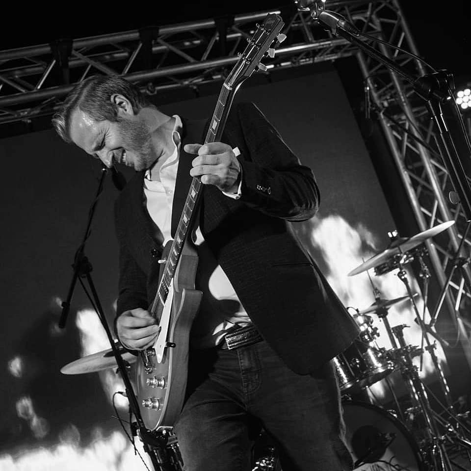 Guitarist performing live on stage