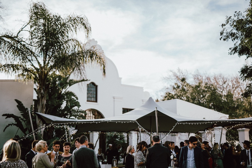 Outdoor proposal setup with tent and greenery