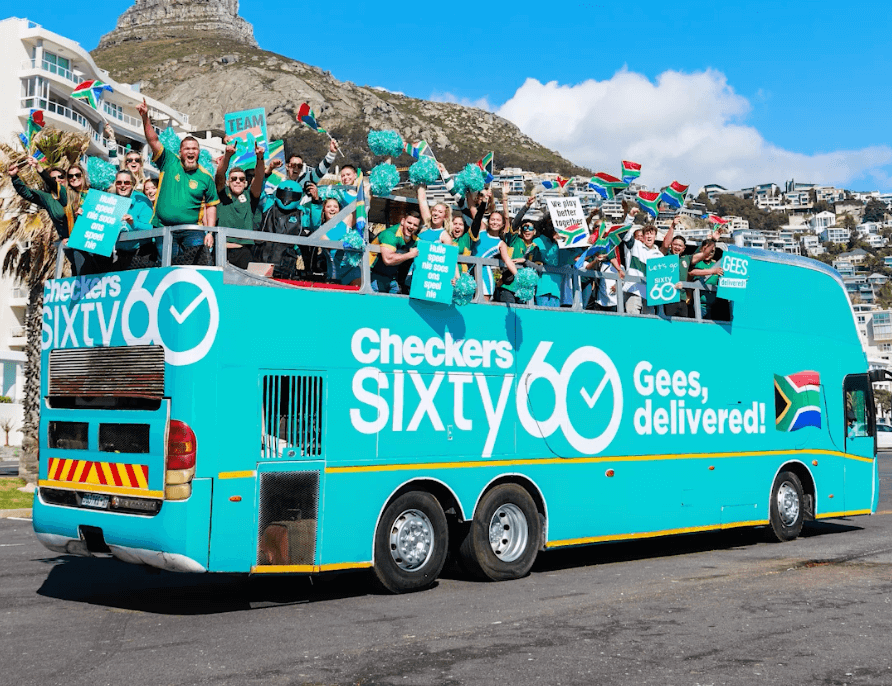 Open top party bus with enthusiastic group celebrating