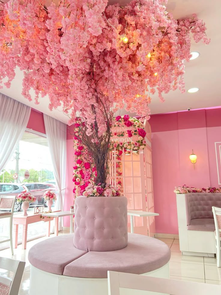 Overhead pink floral display in a decorated venue