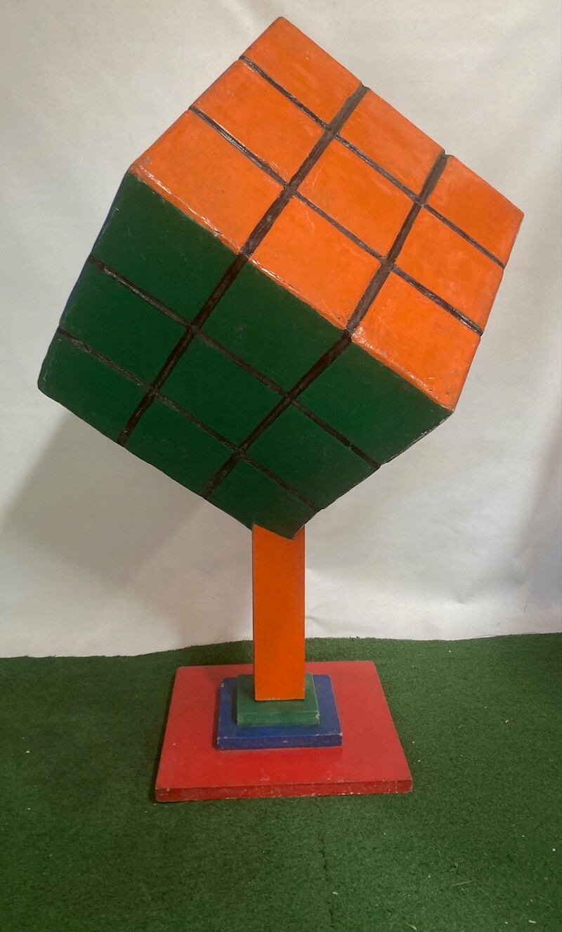 Oversized Rubik's Cube prop on a stand