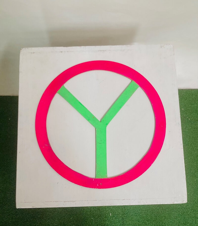 Colorful doughnut wall with pink and green design.