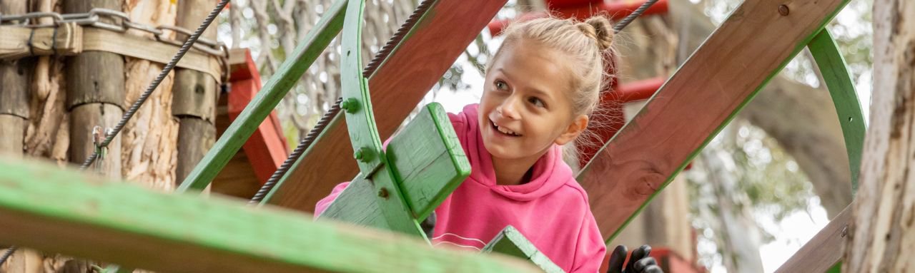 Child enjoying the adventure play area