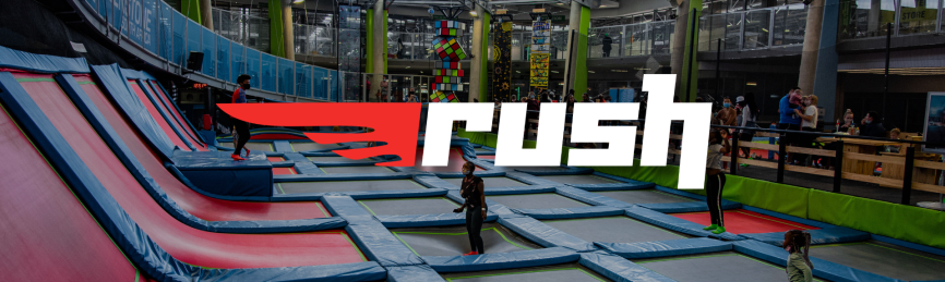 A colorful trampoline park with children jumping.