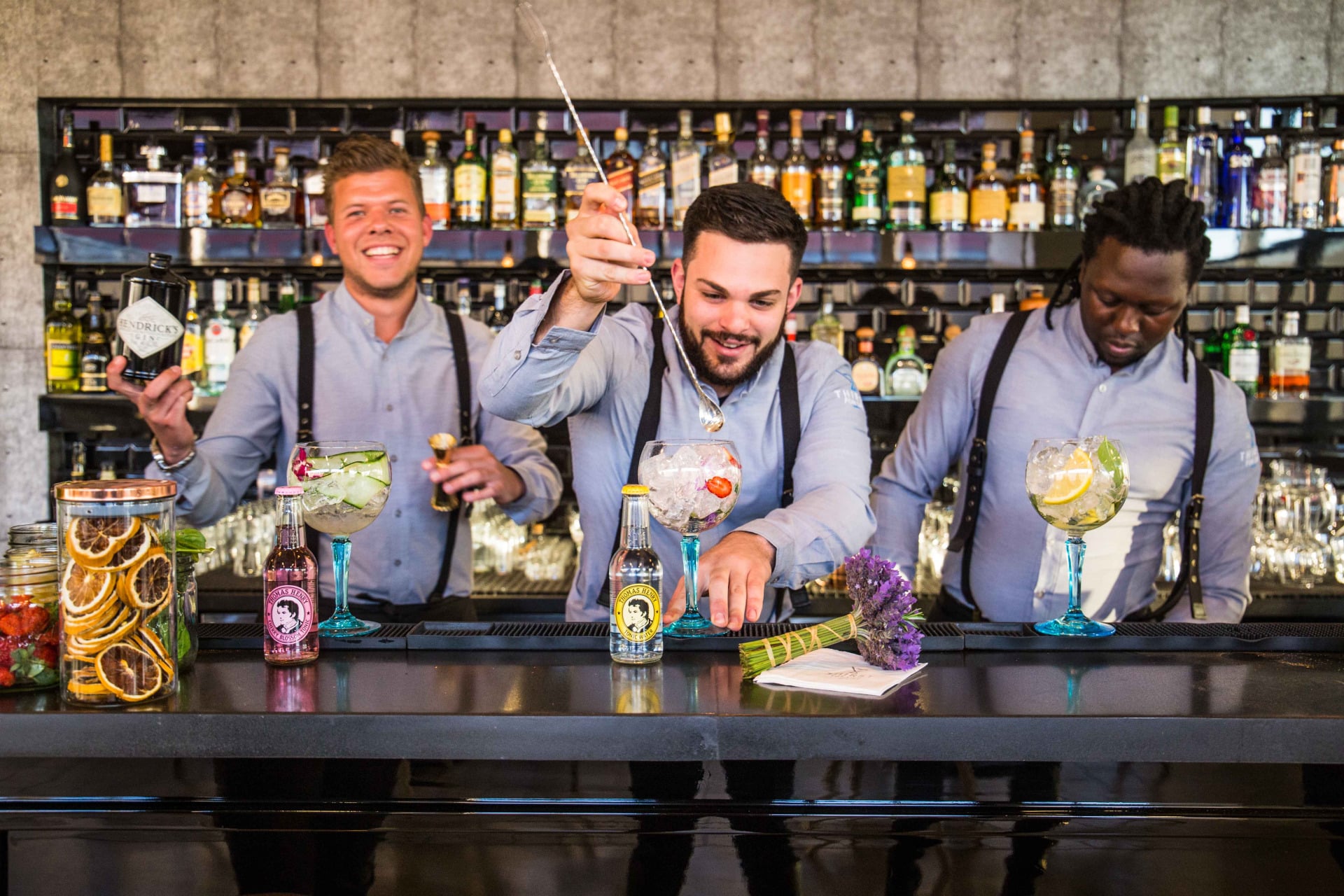 Bartenders preparing cocktails at a mobile bar