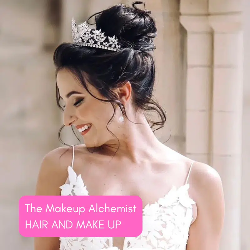 Bride smiling with tiara and elegant hairstyle