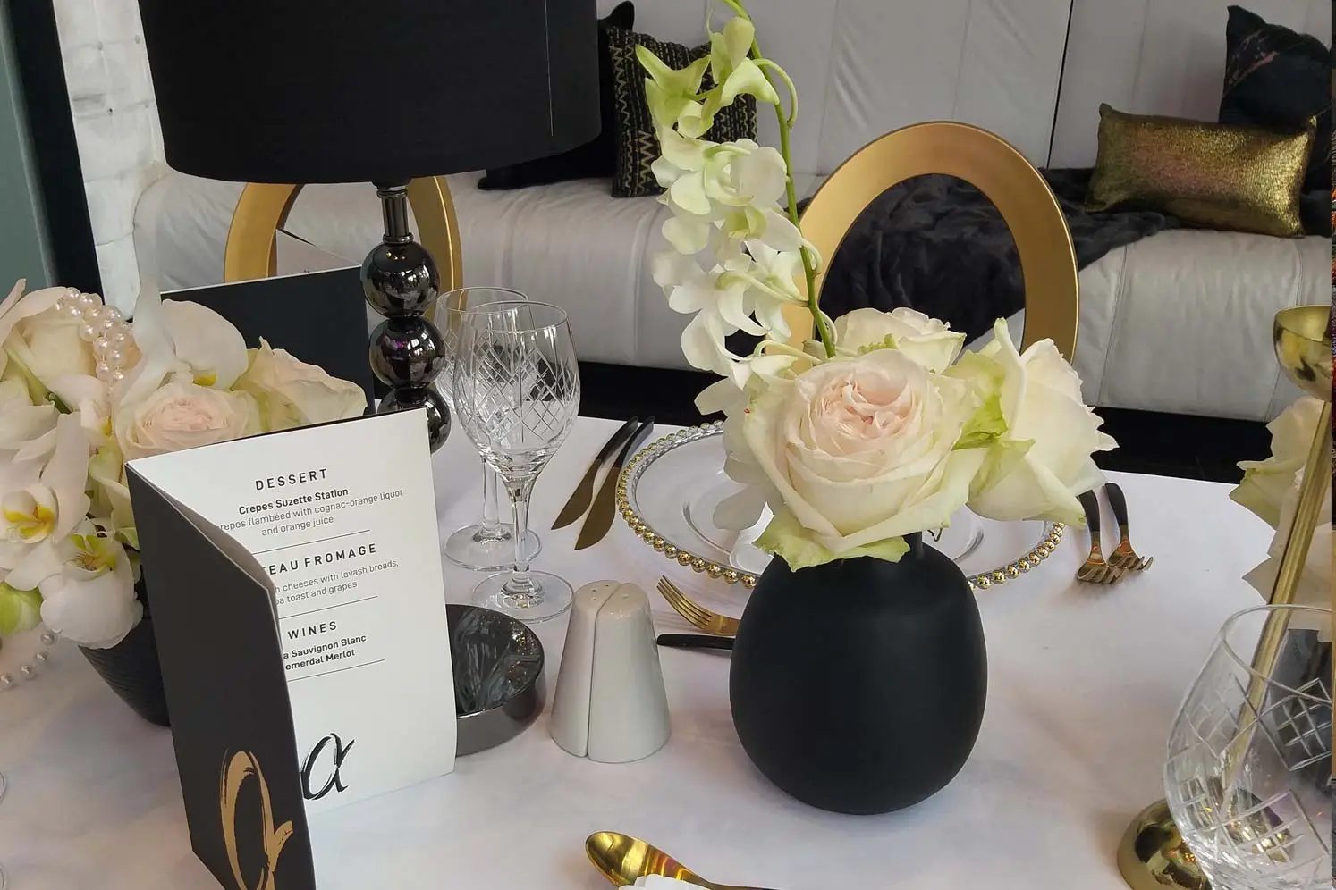 Elegantly arranged table with floral centerpiece and stylish dinnerware.