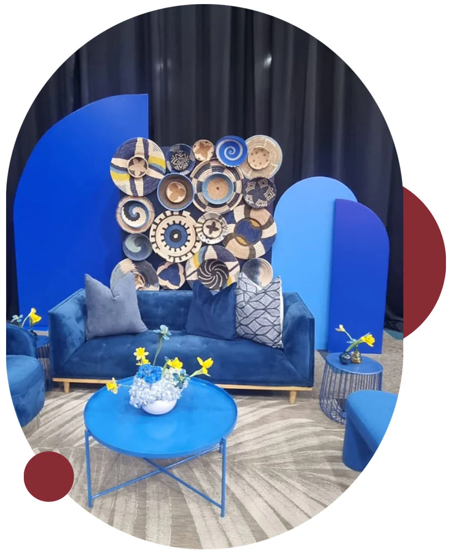Lounge setup with blue furniture and decorative wall art