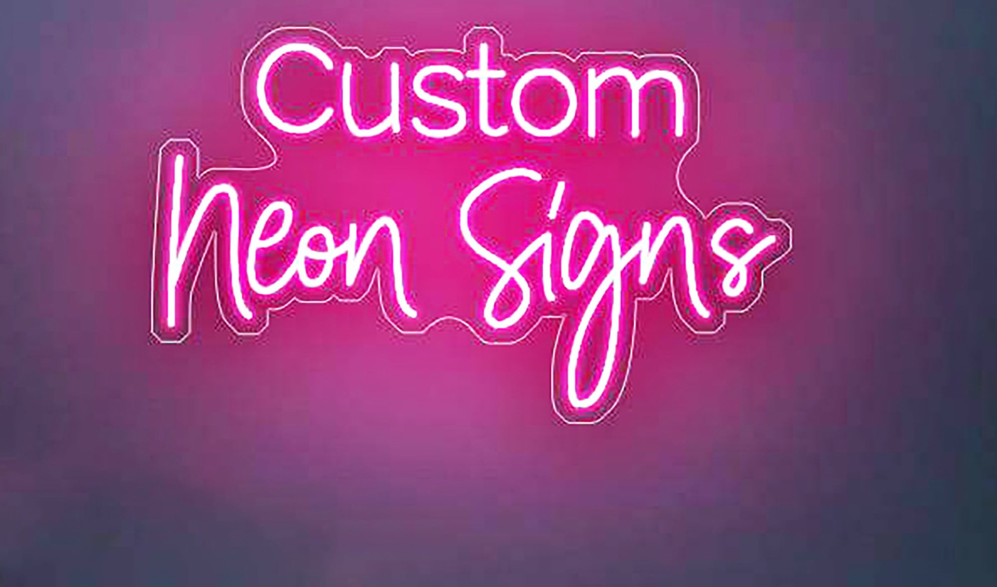 Bright pink custom neon sign displaying 'Custom Neon Signs'