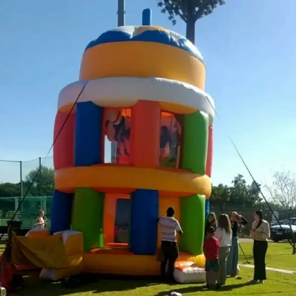 Colorful inflatable funhouse with children playing inside