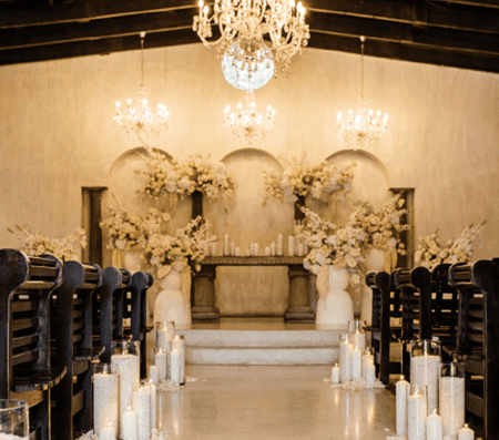 Elegant chapel interior with floral decorations and candles