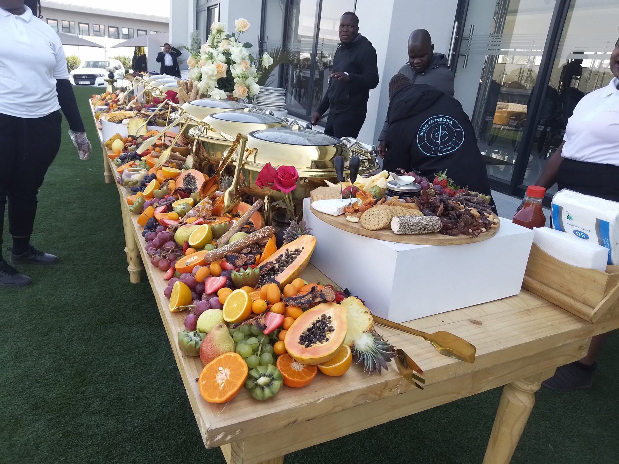 Buffet table with fruits and gourmet platters