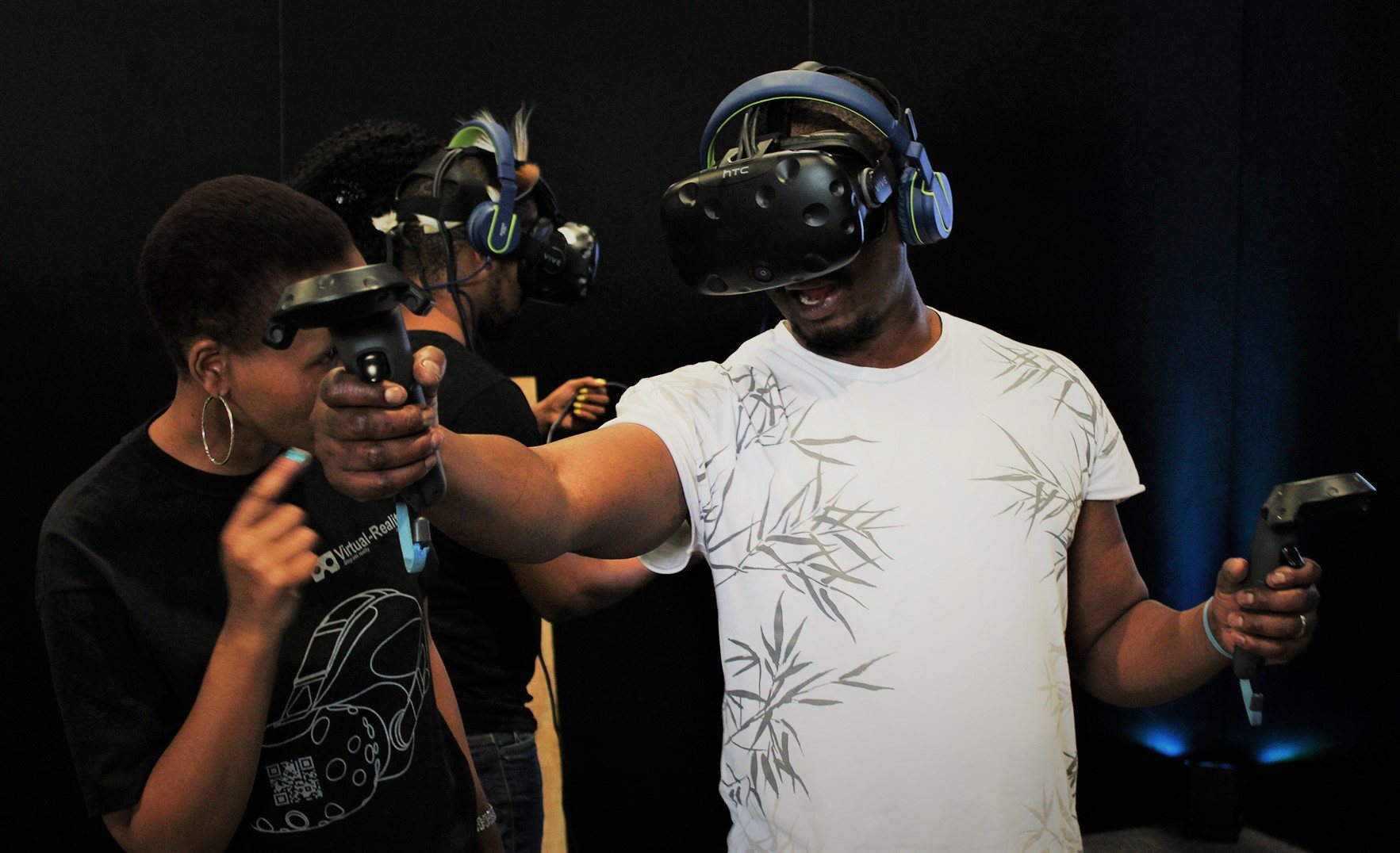Participants enjoying virtual reality headsets and controllers