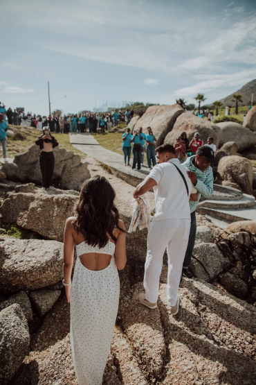 Guests enjoying a drive-in wedding setup at a coastal venue.