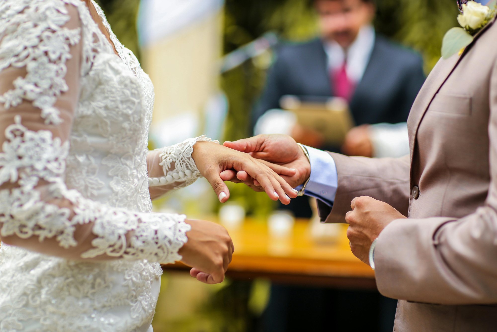 Couple exchanging rings during a wedding ceremony