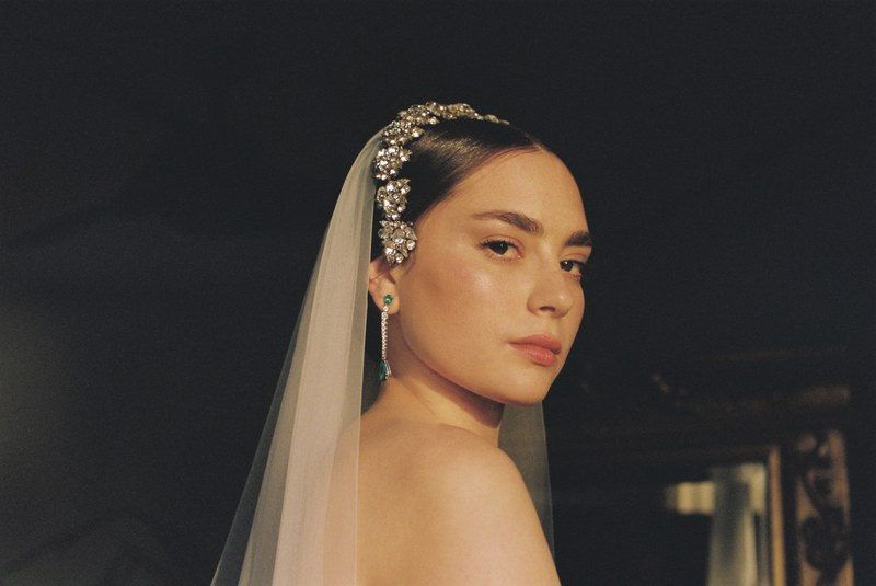 A bride wearing a sparkling headpiece and veil