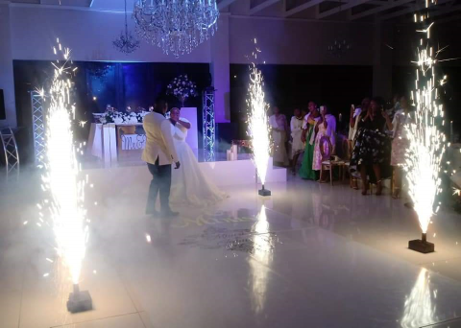 Indoor fireworks lighting up a wedding dance floor