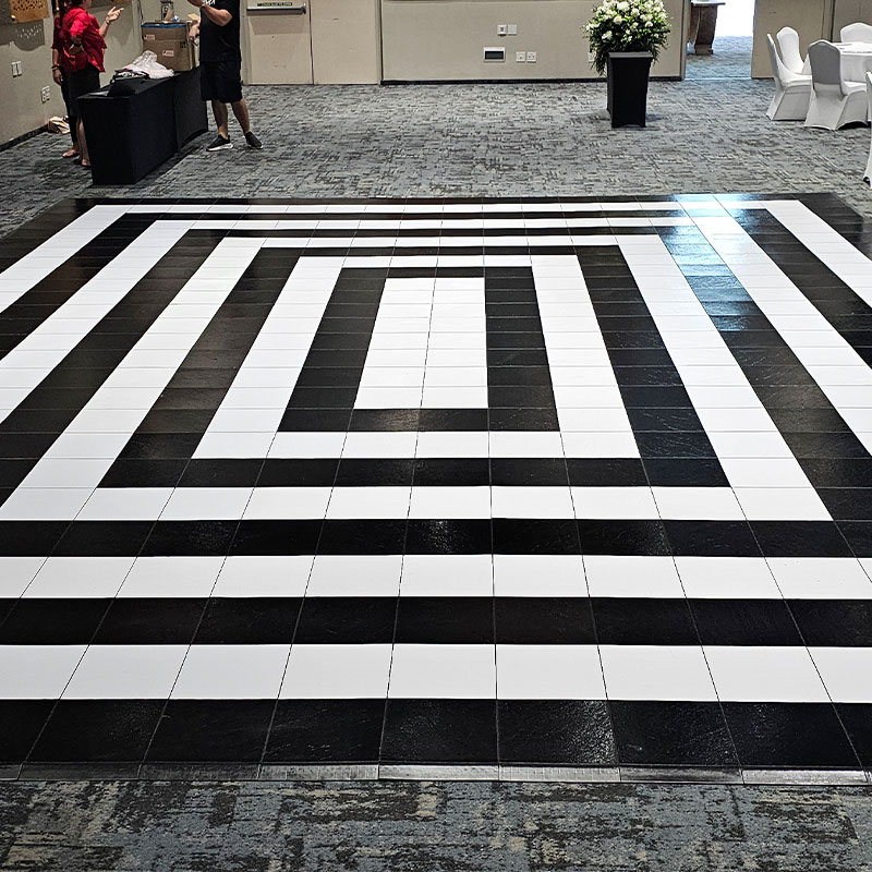Black and white dance floor setup in a venue