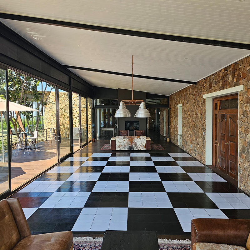 Black and white checkerboard dance floor in a modern venue